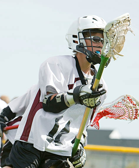 Young lacrosse player in action on the field