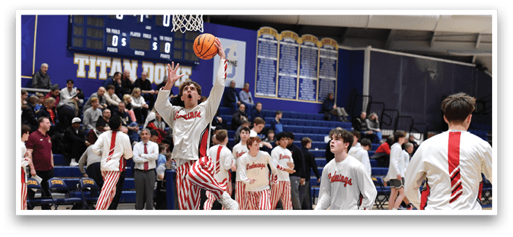 A basketball player in a white jersey is holding a basketball in the air, preparing to shoot it. The player is surrounded by other players on the court. AI generated content