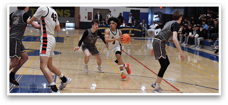 A group of young men playing basketball on a court. AI generated content