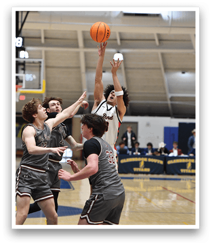 A group of men playing basketball, with one man attempting to block a shot. AI generated content