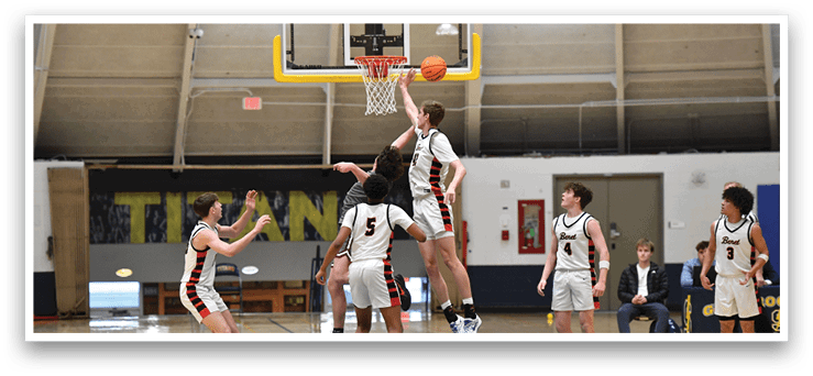 Basketball players on a court, one of them jumping to block a shot. AI generated content