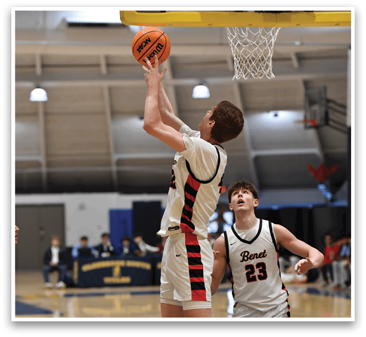 Two men are playing basketball, one of them jumping to block the other's shot. AI generated content