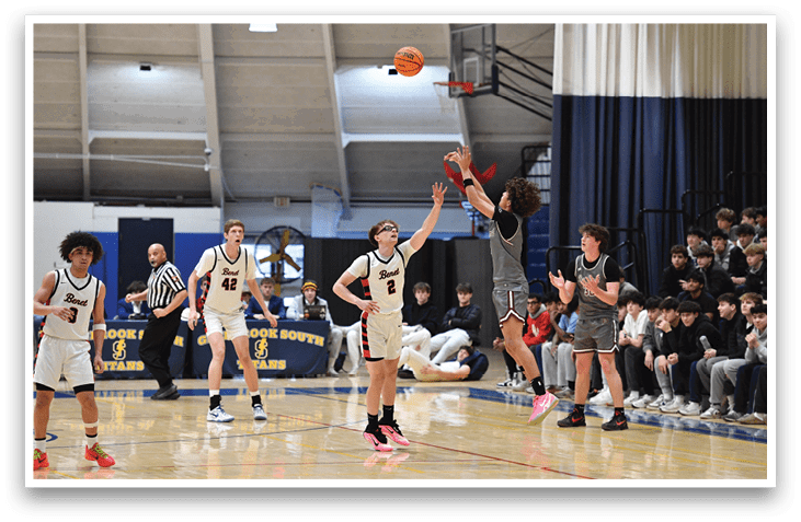 A group of young men playing basketball on a court. One player is attempting to block a shot. AI generated content