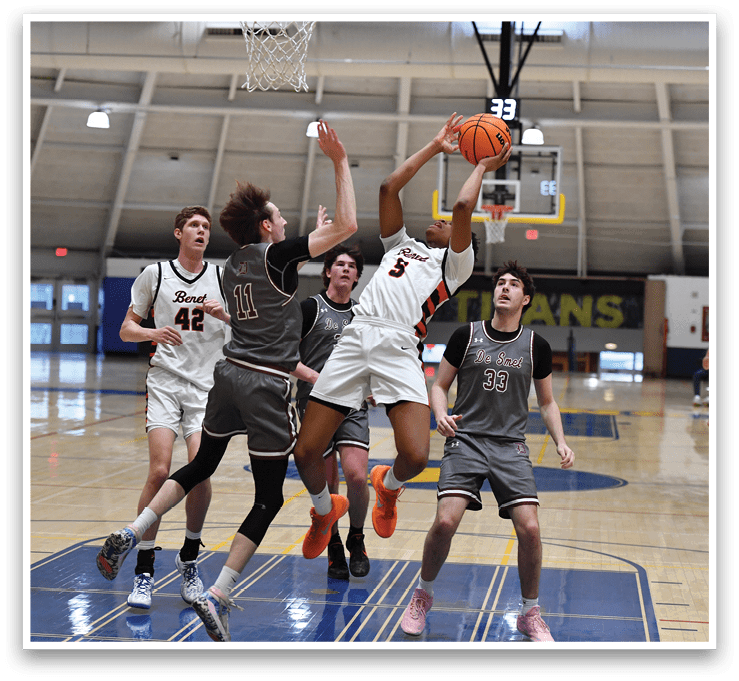 A group of basketball players are playing a game. One player is attempting to block a shot. AI generated content