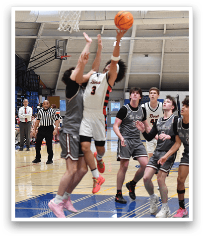 Basketball players on a court, one of them jumping to block a shot. AI generated content