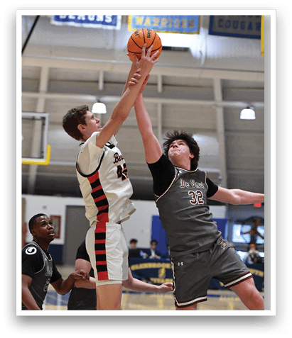 Two basketball players are fighting for a rebound, with one player reaching for the ball. AI generated content