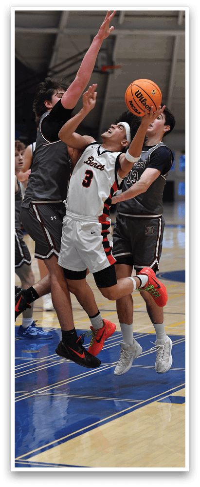 A group of basketball players on a court, one of them is attempting to block a shot. AI generated content