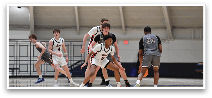 A group of young men playing basketball on a court. AI generated content