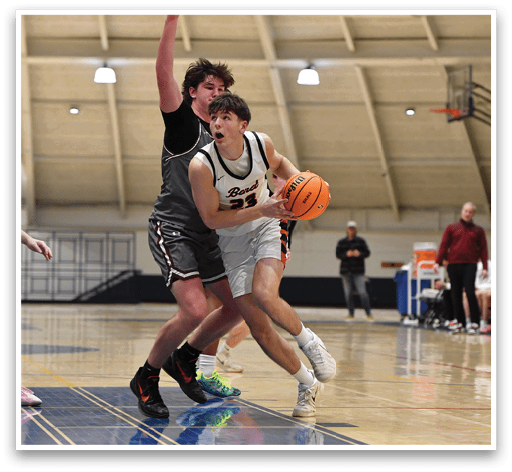 Two men are playing basketball on a court. One man is holding a basketball while the other man is trying to block him. AI generated content