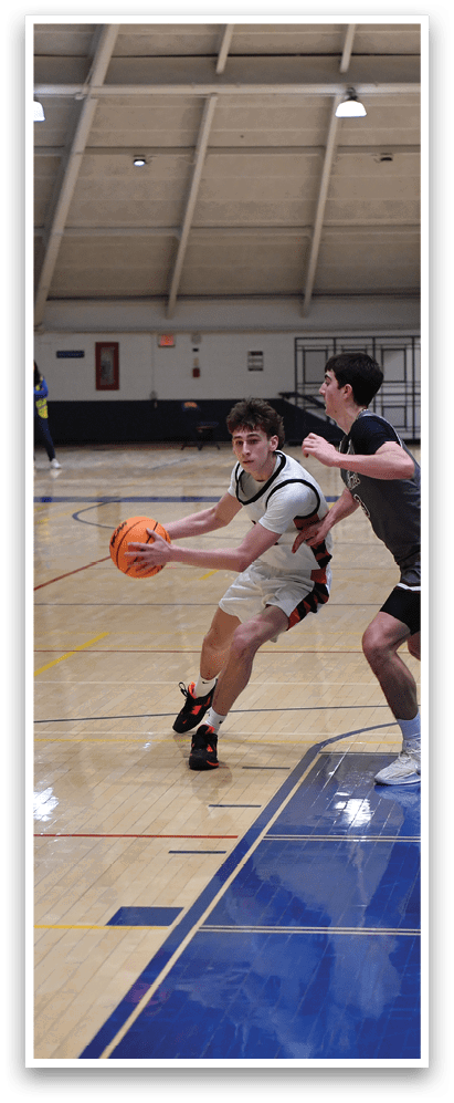 A group of young men playing basketball on a court. AI generated content