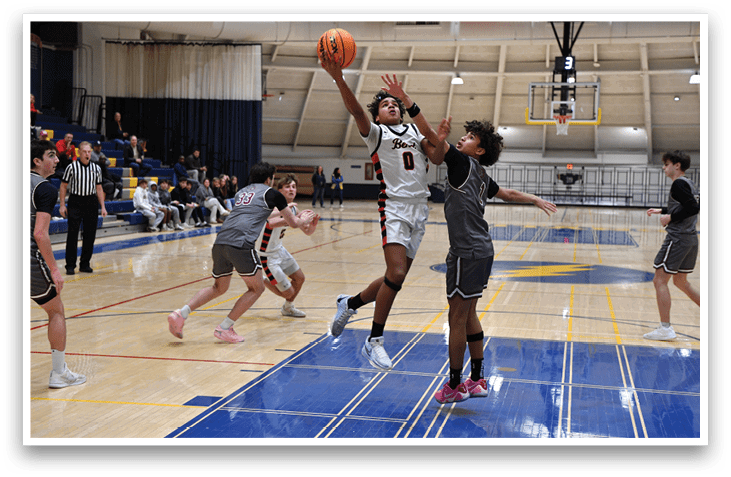 A basketball game is taking place with two teams playing. One player is attempting to block a shot, while another player is trying to get the ball. The scene is set in a gym with a crowd watching the game. AI generated content