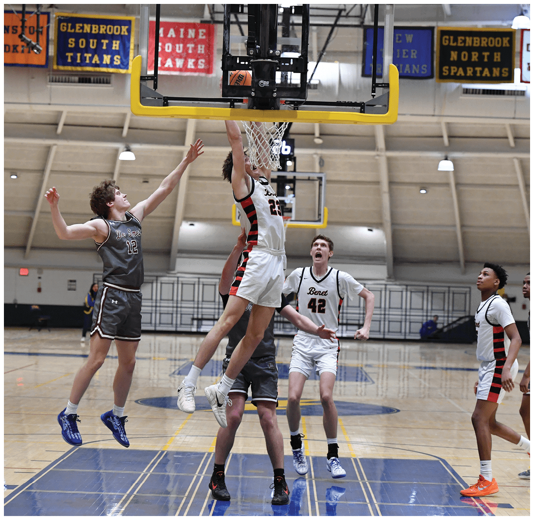 Basketball players in action on a court, with one player jumping to block a shot. AI generated content