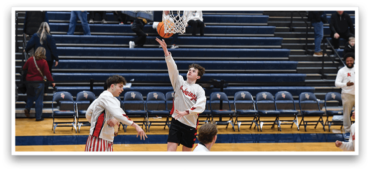 A basketball player in a white shirt and red and white striped pants is jumping to catch a basketball. AI generated content