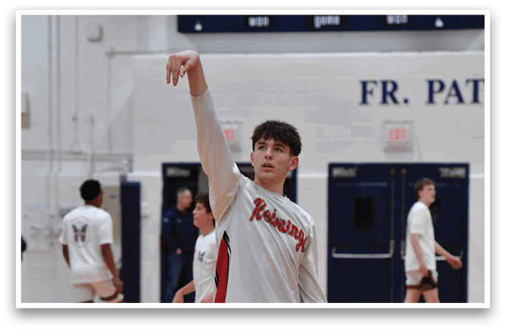 A basketball player in a striped shirt and red shorts is holding his arms up in the air. AI generated content