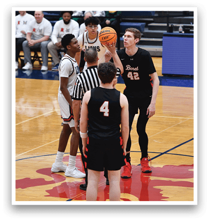 A group of basketball players on a court, with one player holding a basketball. AI generated content