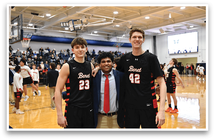 Two basketball players pose with a man in a suit. AI generated content