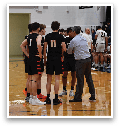 A group of young men are standing on a basketball court, engaged in a conversation. AI generated content