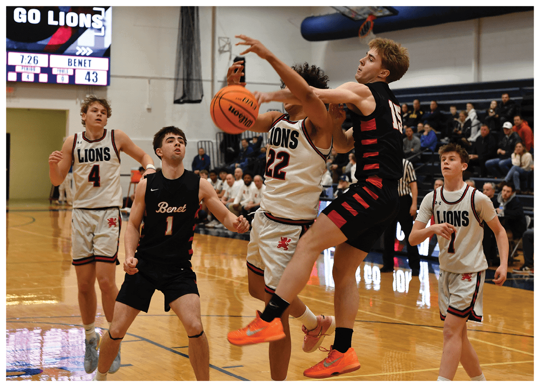 A group of young men playing basketball, with one player jumping in the air to block a shot. AI generated content