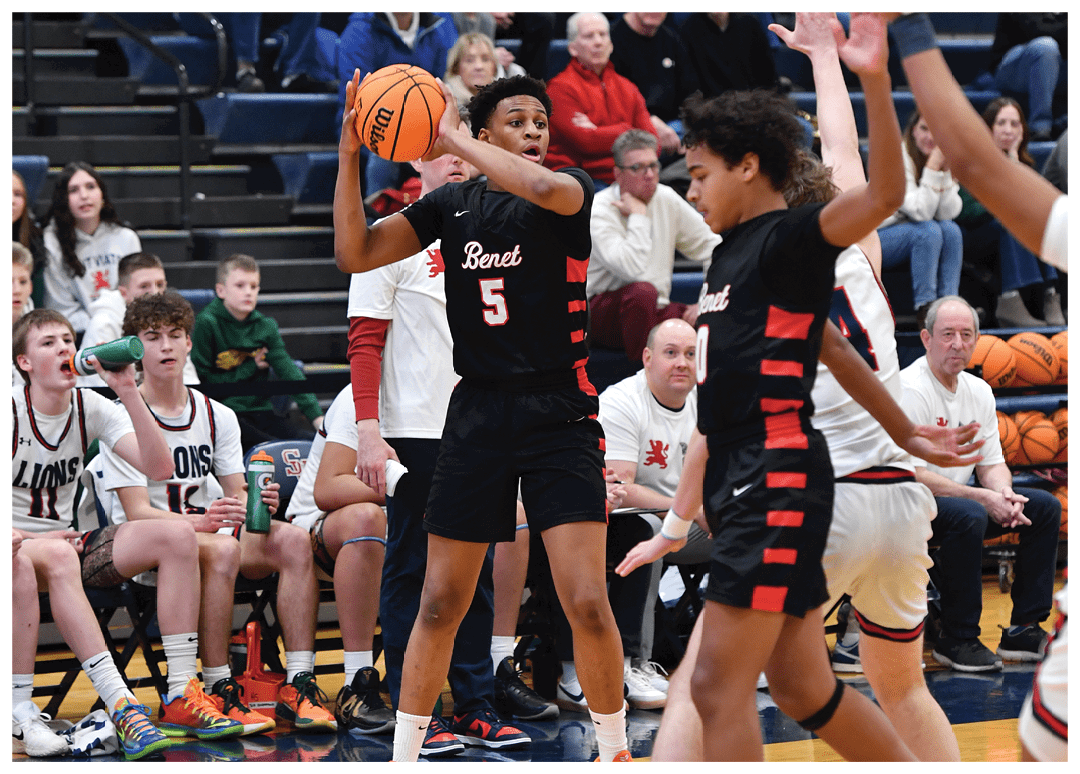 A basketball player is dribbling the ball while other players are watching. AI generated content