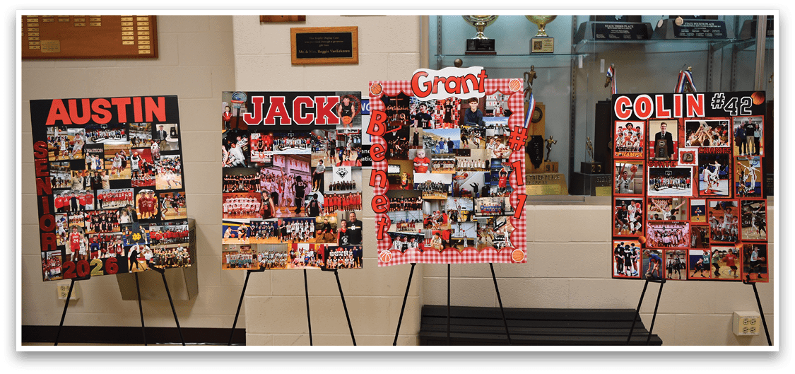 Two posters are displayed on stands in a hallway, one featuring a man named Austin and the other featuring a man named Jack. AI generated content