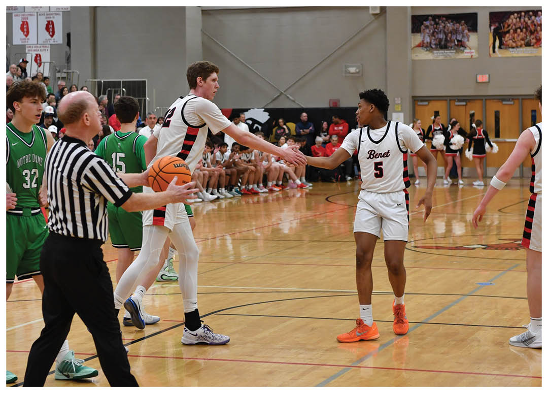 Basketball game in progress with players on the court and a referee. AI generated content