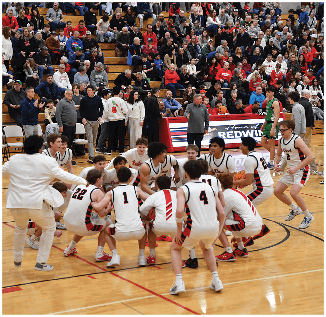A group of young men in white uniforms are huddled together on a basketball court. AI generated content