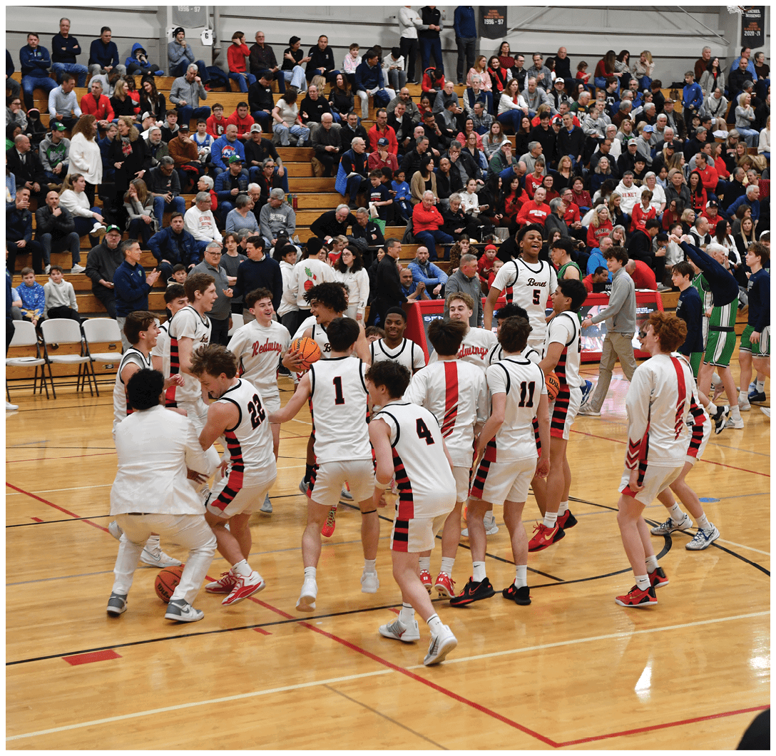 A group of young men playing basketball on a court, with a crowd watching. AI generated content
