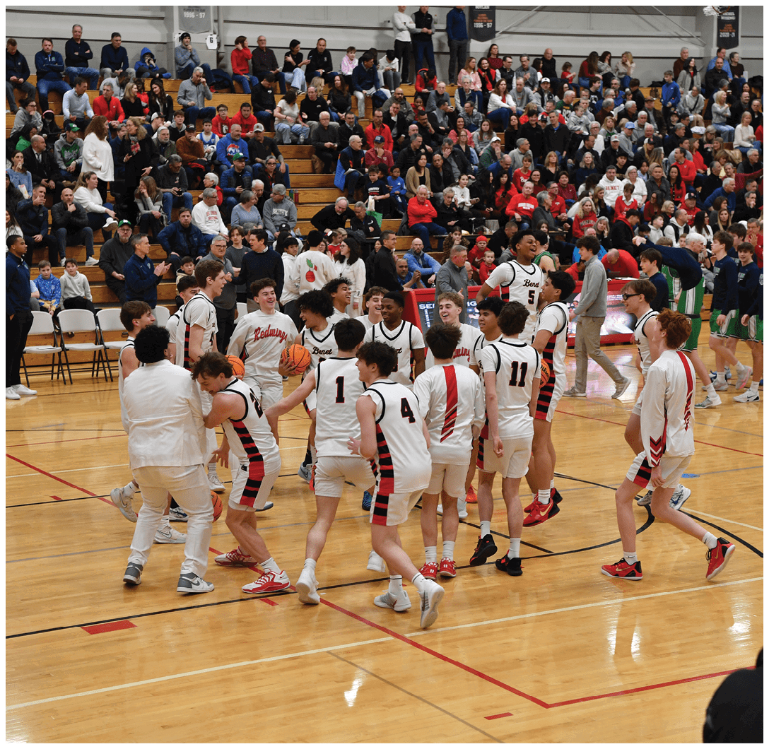 A group of young men are playing basketball on a court, with a crowd of people watching from the stands. AI generated content