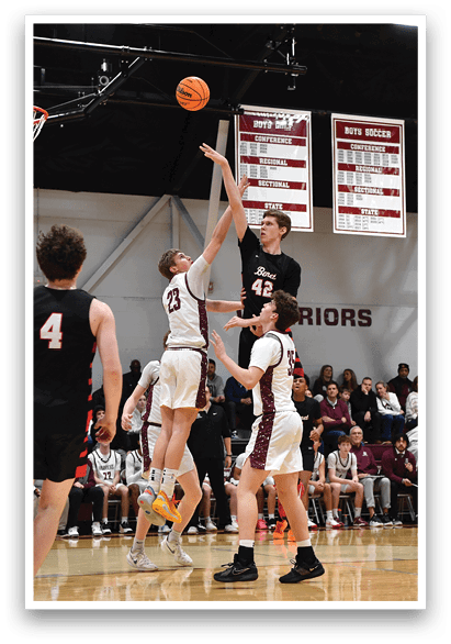 A group of young men playing basketball, with one player jumping to block a shot. AI generated content