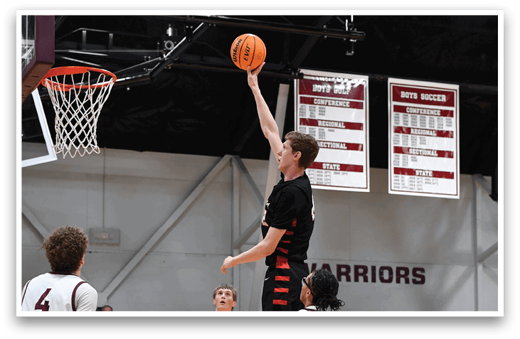 A basketball player leaps to block a shot, while the opposing team looks on. AI generated content