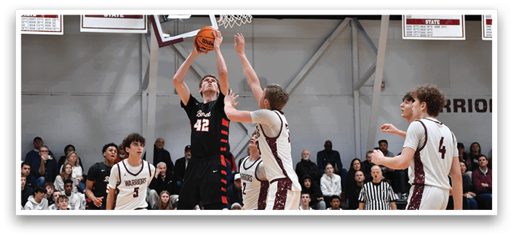 Basketball players on a court, one of them is jumping to block a shot. AI generated content