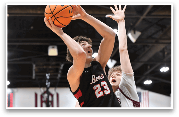 Two men are playing basketball, one of them is trying to block the other's shot. AI generated content