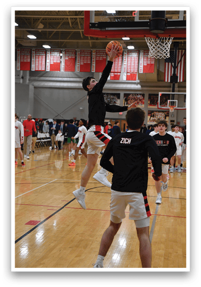 Two men are playing basketball, one of them jumping to hit the ball. AI generated content