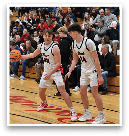 Two men are playing basketball on a court, surrounded by a crowd of people watching. AI generated content