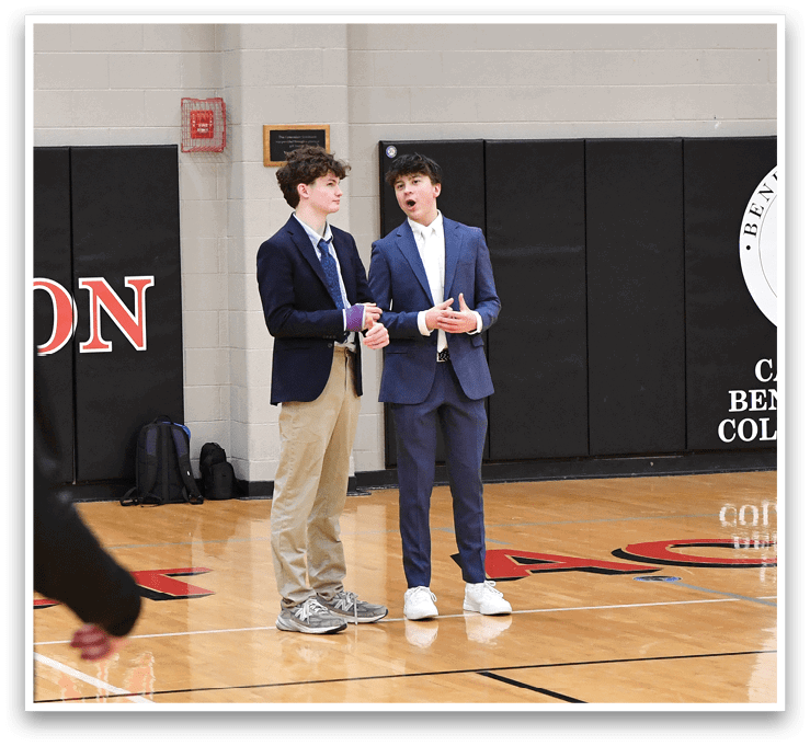 A group of young men are playing basketball in a gym. AI generated content