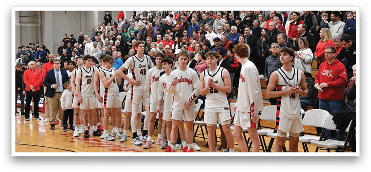 A group of young men in uniforms are standing on a basketball court, lined up in front of a crowd of people. AI generated content