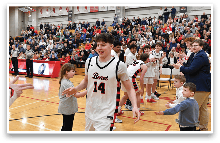 A basketball player wearing a jersey with the number 14 walks onto the court, surrounded by his teammates. AI generated content