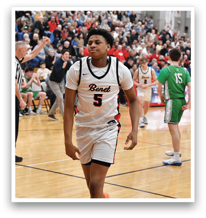 A basketball game is taking place with a crowd of people watching. A man wearing a basketball uniform is walking onto the court. AI generated content