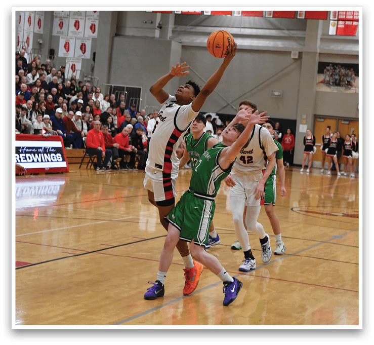 A basketball game is taking place with a player in the air attempting to shoot the ball. The game is being watched by a crowd of people. AI generated content