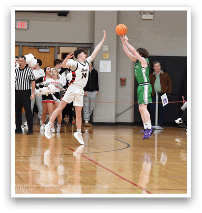 A basketball game is in progress with a player in a green jersey attempting to shoot the ball. The game is being watched by a crowd of people, some of whom are standing and others are sitting. The spectators are spread out around the court, with some closer to the action and others further away. The atmosphere is lively and filled with anticipation as the players and audience members await the outcome of the shot. AI generated content