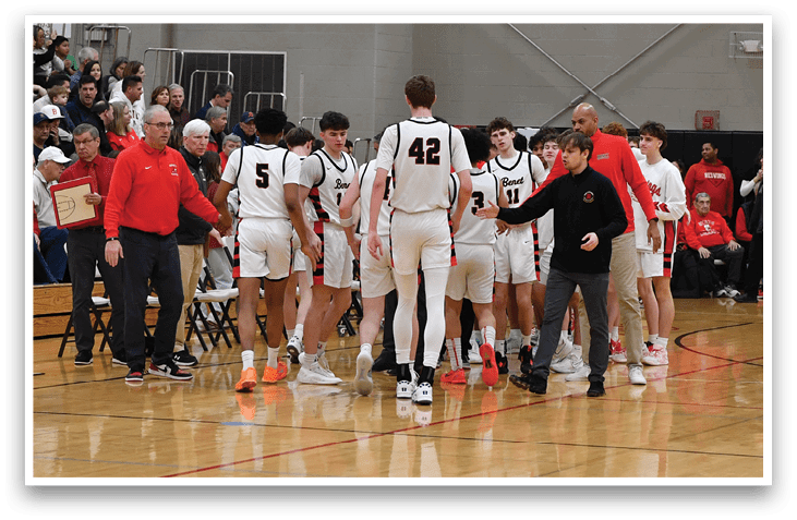 A group of basketball players huddle on the court. AI generated content