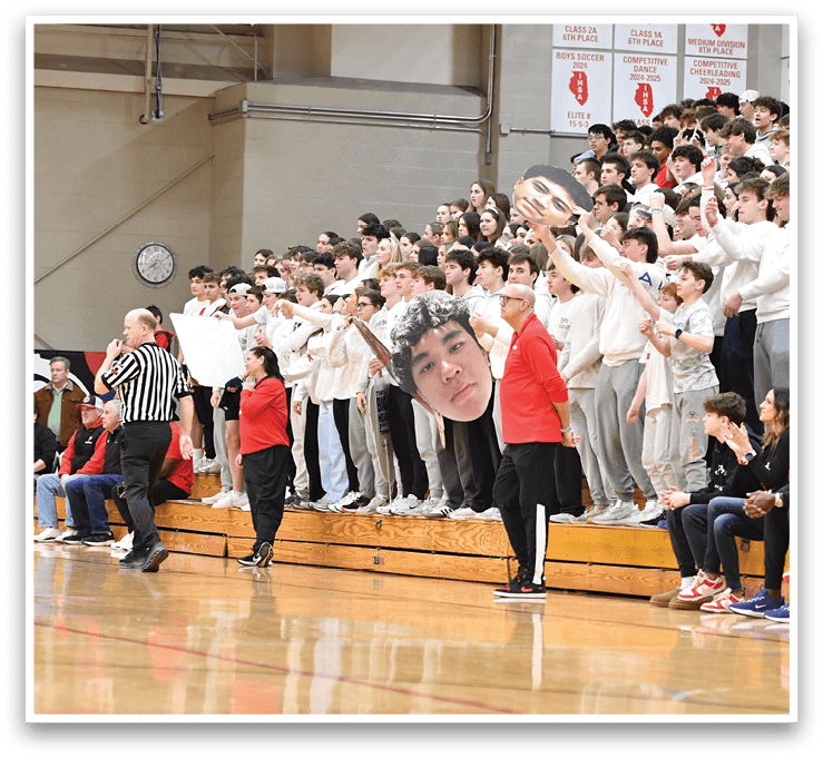 A basketball game is taking place with a crowd of people watching. The players are on the court, and the audience is seated in the bleachers. The spectators are engaged in the game, with some clapping and cheering for the players. The atmosphere is lively and energetic, as everyone is enjoying the sporting event. AI generated content