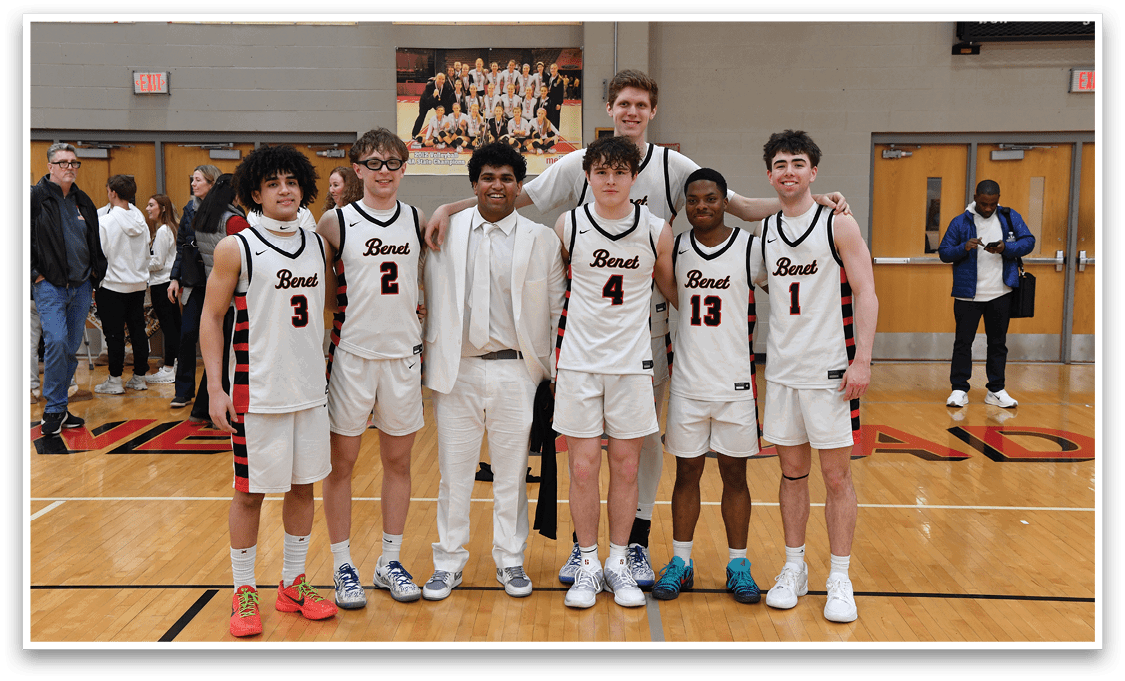 A group of young men in white and red uniforms pose for a photo on a basketball court. AI generated content