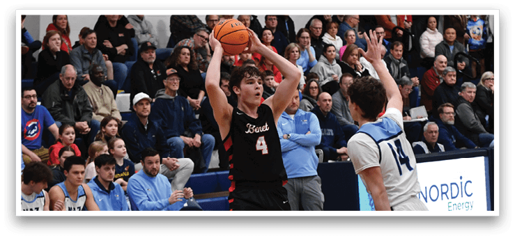 A basketball game is taking place with a crowd of people watching. A player is holding a basketball in the air, and another player is trying to block him. The spectators are seated on chairs, and some are standing. The atmosphere is lively and competitive. AI generated content