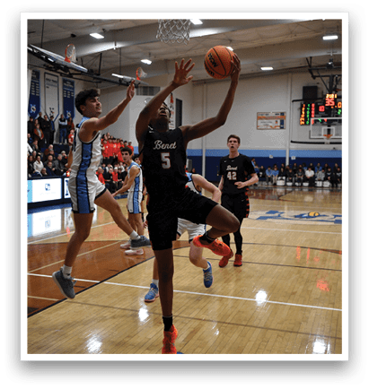 A basketball player is reaching for the ball with his teammates in the background. AI generated content