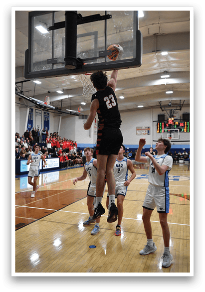 A group of people are playing basketball in a gym. One man is jumping up to hit the ball with his head. AI generated content