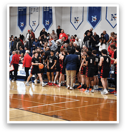 A group of people are standing on a basketball court, some holding a basketball. AI generated content