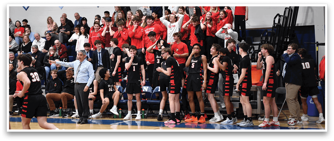 A group of people are sitting on a bench in a gym, watching a basketball game. AI generated content