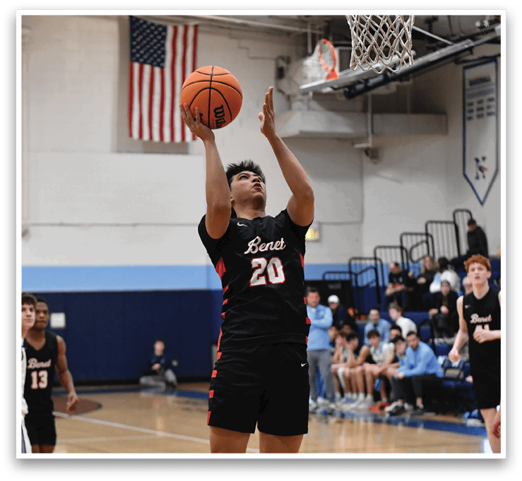 A basketball player in a black jersey is jumping to shoot the ball. AI generated content