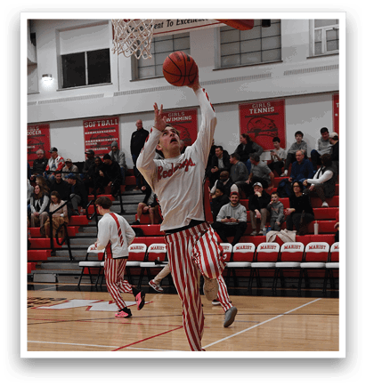 A basketball player is dribbling a ball in front of a crowd of people. AI generated content
